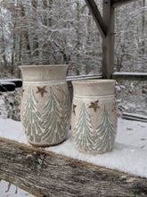 Load image into Gallery viewer, Small votive candle holder with winter trees scene. Ceramic holiday lantern tea lite votive stars moon