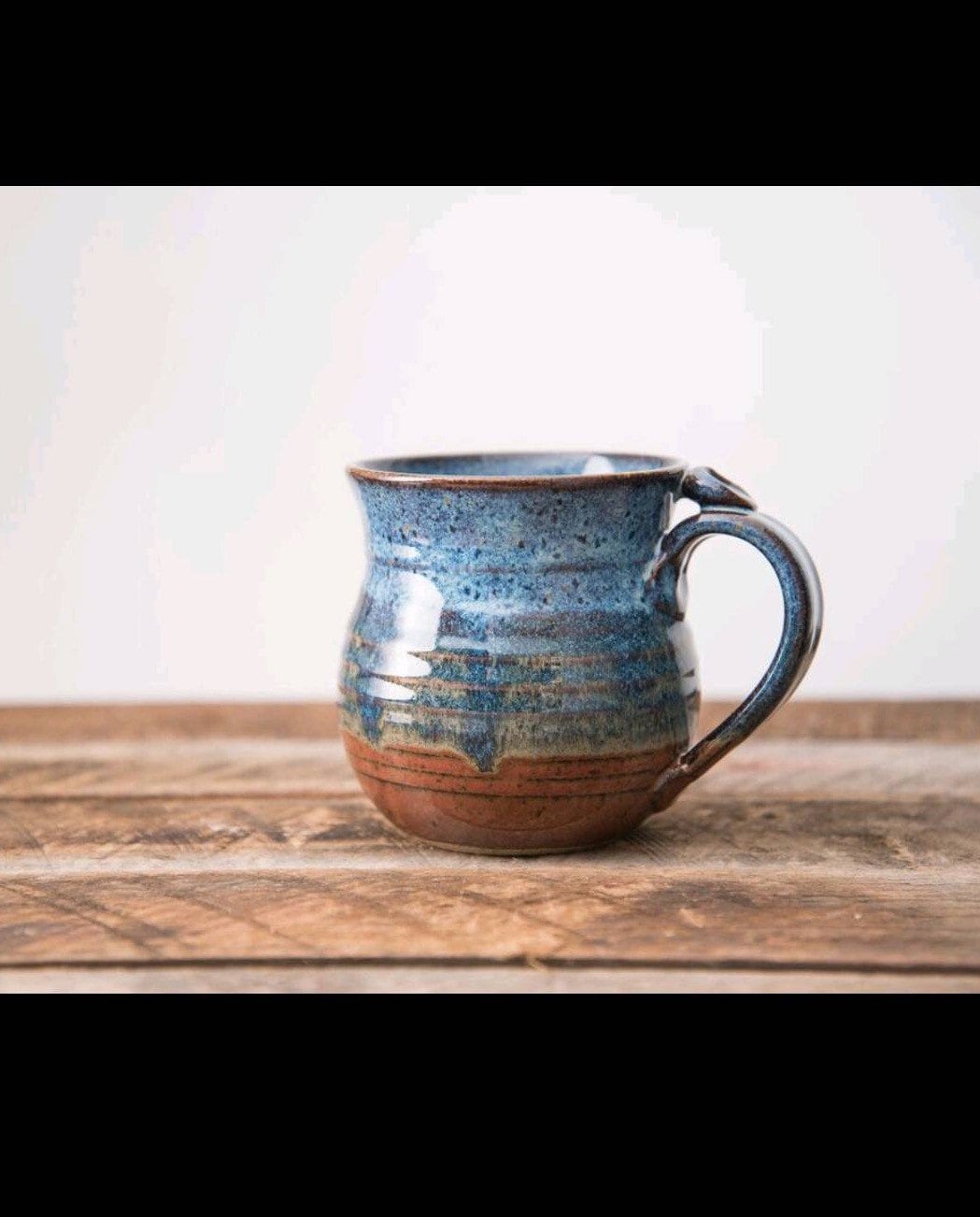 Blue and rust red hand thrown stoneware mug Clay Coffee cup thumb rest